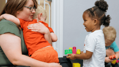 Woman hugging child.